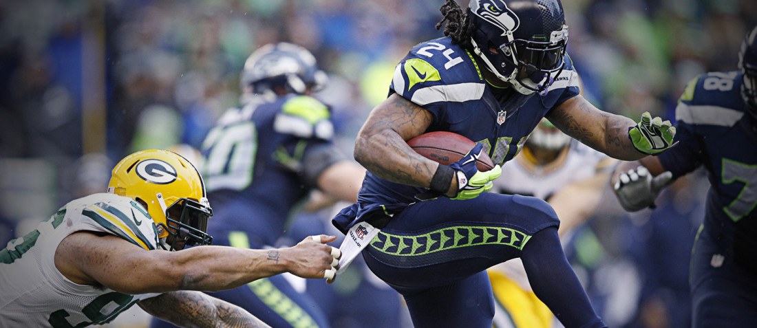 Marshawn Lynch carries the ball versus the Green Bay Packers in a NFC Championship matchup