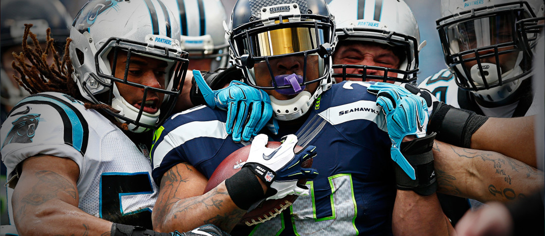 Marshawn Lynch carries the ball versus the Carolina Panthers